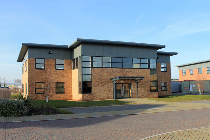 Exterior of empty modern office building to let on business park.